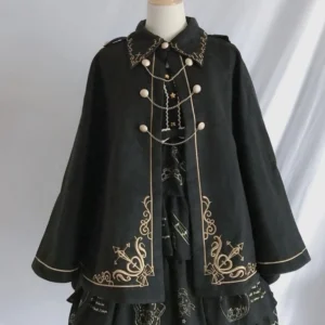 Steampunk gothic wool cloak on dress form mannequin with gold decorative trims paired with lolita style skirt