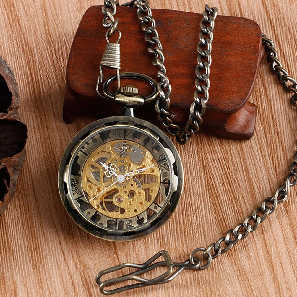 Gunmetal black skeleton pocket watch with angled view displaying dark metal frame and intricate mechanical gears on wooden display stand