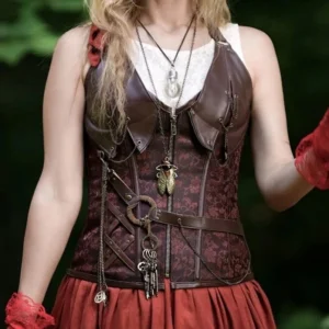 Steampunk halter corset in brown jacquard featuring key and mechanical insect-themed pendant details, front view with greenery background