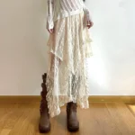 Ivory asymmetric lace steampunk skirt with high-low hem and layered ruffled details, front view full length on model