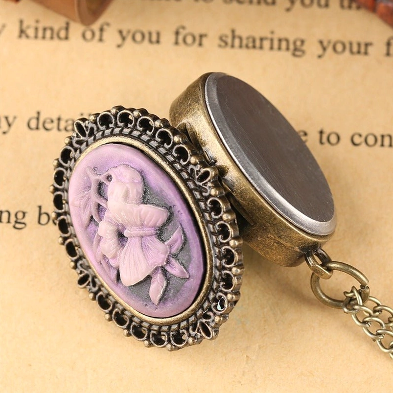 Back view of lilac cameo pendant showing bronze filigree frame and metal backplate detail