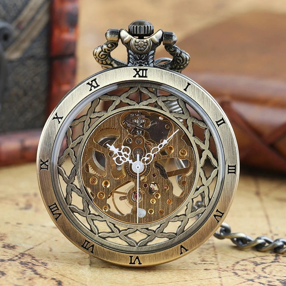 Mechanical skeleton pocket watch front close-up view featuring ornate top crown, Roman numeral bezel, and visible brass movement components against blurred vintage leather and wooden props background