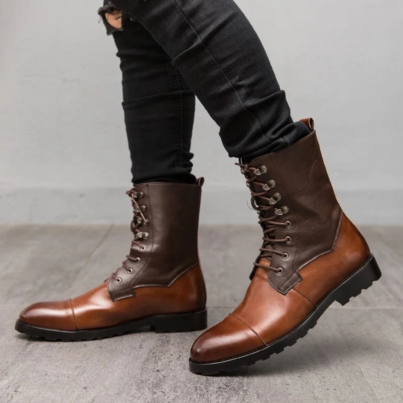 Men's steampunk leather combat boots side profile showcasing contrasting brown leather gradient, rugged traditional lace-up fastener with metal hardware, thick heavy-duty rubber sole with aggressive tread pattern