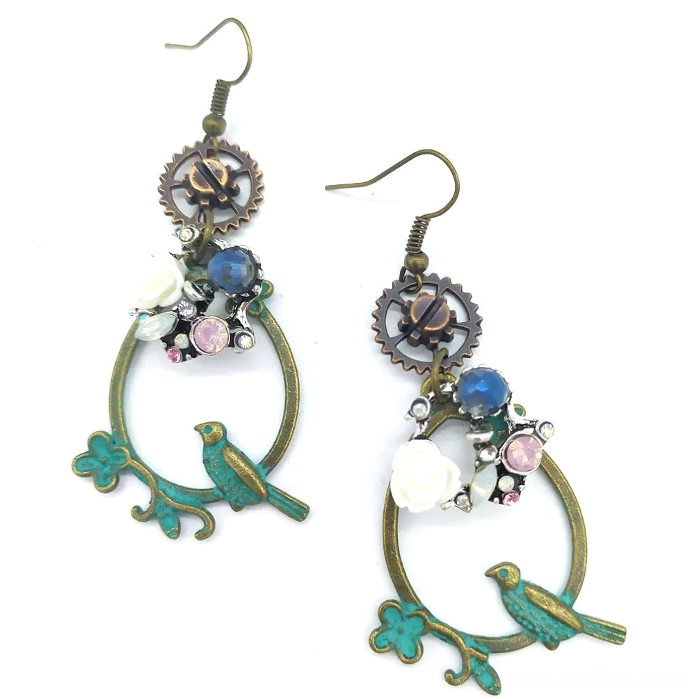 Mini steampunk flower bird loop earrings with small verdigris bronze hoop, ornate gear charm, white delicate flower, blue bead, and pink decorative gems