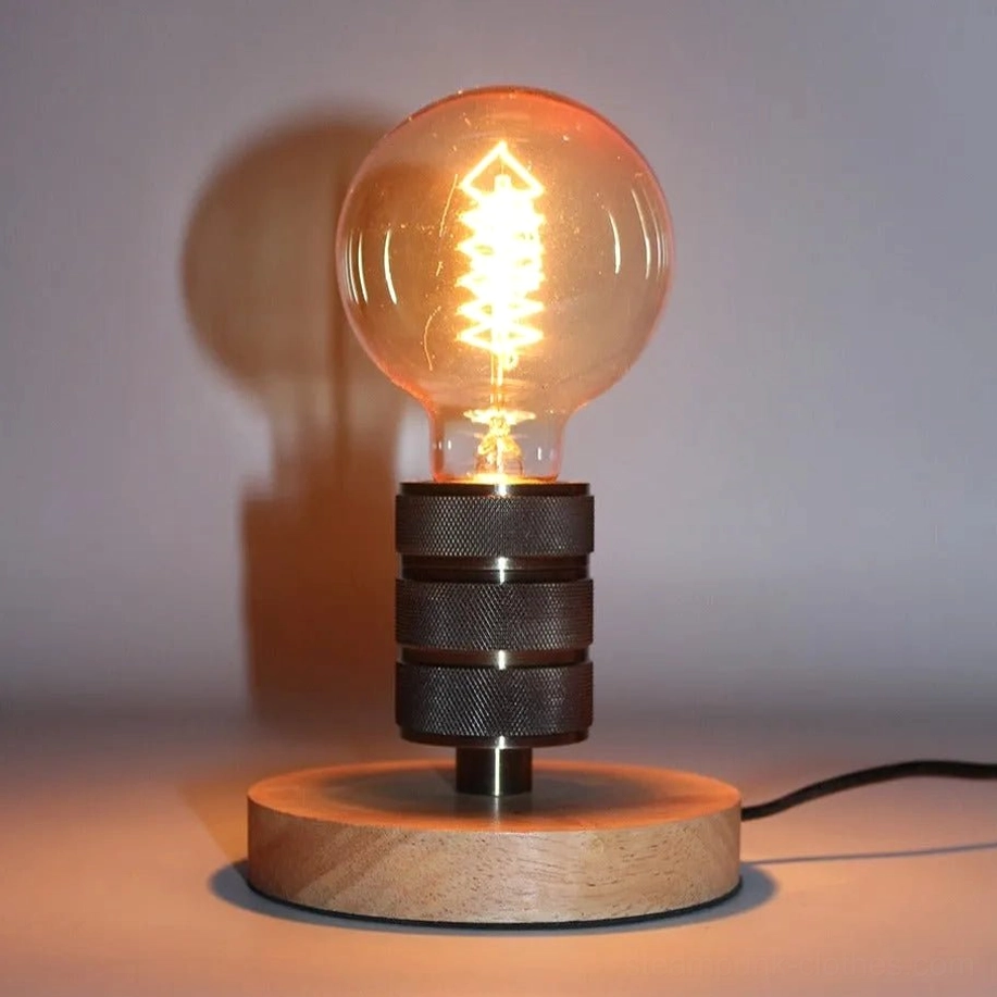 Minimalist steampunk table lamp with natural wood base and knurled aluminum stand featuring warm Edison bulb illuminated in minimal indoor setting