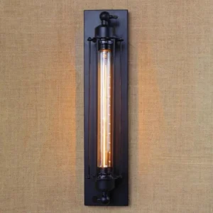 Nautilus steampunk industrial wall lamp with matte black metal frame and exposed Edison filament bulb, frontal close-up view showing protective cage design