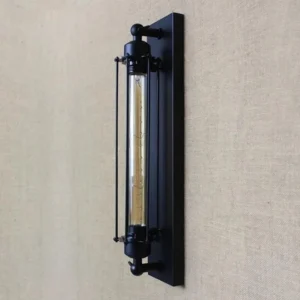 Steampunk wall sconce side profile showing black mounting plate, tubular Edison bulb, and protective metal rod safety guard, industrial aesthetic