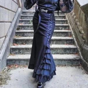 Navy blue mermaid steampunk fishtail skirt with cascading ruffles and side lace-up detail, worn on female model in outdoor stone setting