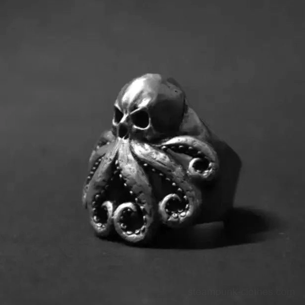 Octopus skull steampunk ring three-quarter view showcasing polished skull and curled tentacle details on gray background