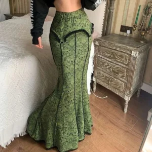 Olive green damask mermaid steampunk skirt with black lace trim and metal ring details, front three-quarter view showing high waist and fishtail silhouette
