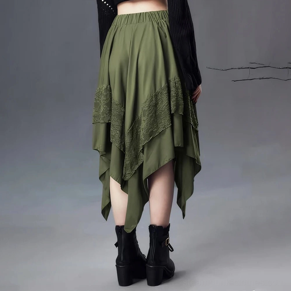 Olive green asymmetrical steampunk skirt rear view showing layered lace-trimmed handkerchief hemline and elastic waistband, paired with black outerwear and ankle boots