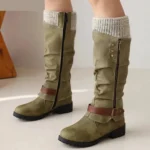 Olive green suede steampunk mid-calf boots with gray ribbed knit collar, brown leather buckle strap, and side metal zipper—front three-quarter view showing authentic Victorian-industrial design details