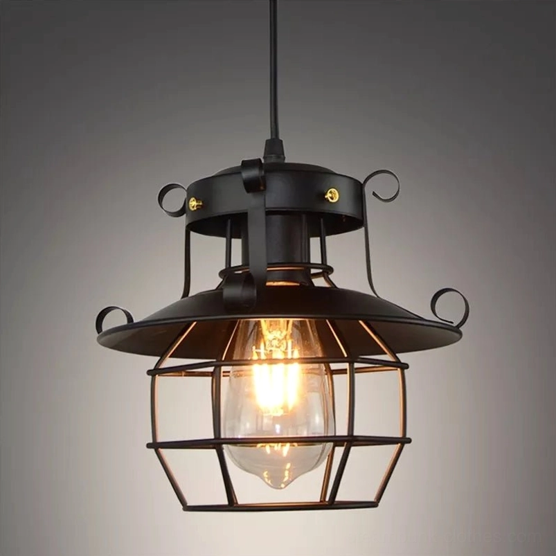 Oxford steampunk industrial pendant lamp with matte black wrought iron frame and intricate scroll accents on wire cage shade, front close-up studio view