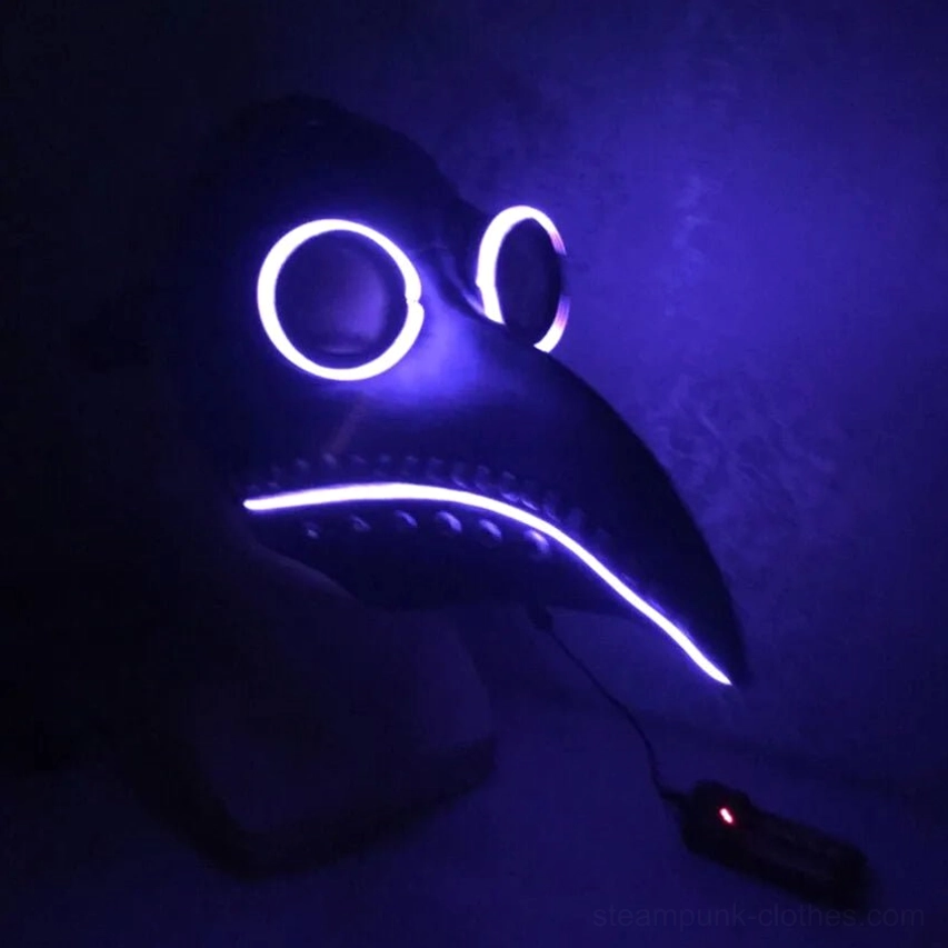 purple LED plague doctor steampunk mask glowing in dark setting, showing luminous eye and beak illumination with power controller, worn on mannequin display