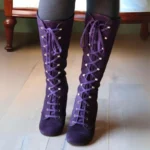 Purple suede steampunk lace-up boots with metal eyelets, front view showing Victorian-style mid-calf height with block heel