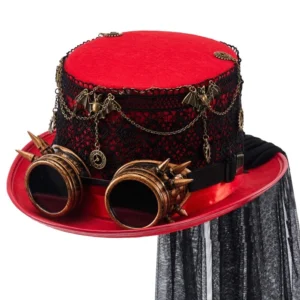 Red steampunk top hat front three-quarter view with brass goggles, black lace band, vintage chains, and black tulle veil on white studio background