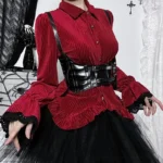 Red velvet steampunk shirt front view on model with black leather corset and lace trim cuffs, gothic home setting