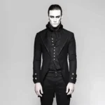 Industrial heritage redingote tailcoat front view - black herringbone formal jacket with standing collar, embossed metal buttons, and faux waistcoat damask panel detail