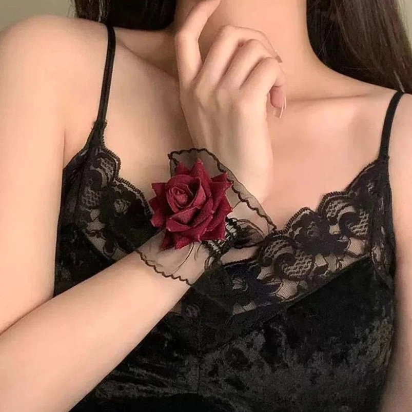 Single gothic rose wrist cuff worn with black lace camisole front view showing wine-red rose and sheer black mesh detail