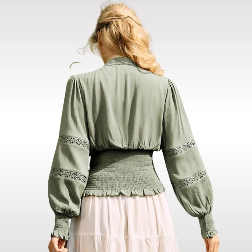 Sage green steampunk blouse back view showing smocked ruffled hem and lace sleeve decorations