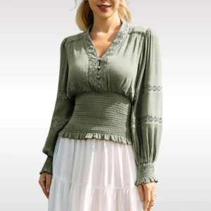 Sage green steampunk blouse front view with V-neck lace trim and lantern sleeves worn by female model