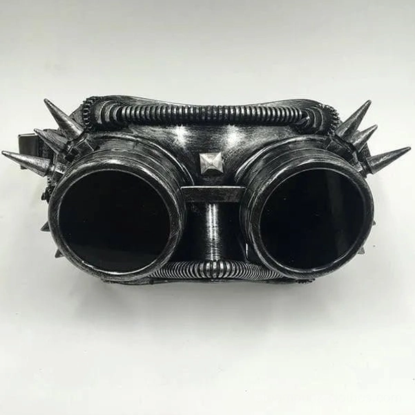 Silver gunmetal steampunk welder mask with spikes and dark lenses, flat front lay-flat photography
