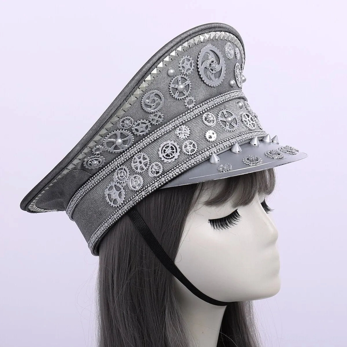 Silver steampunk aviator cap left side profile view on mannequin with chin strap detail