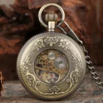 Skeleton steampunk pocket watch with bronze metal finish, floral embossed patterns, exposed mechanical movement visible through crystal caseback, ridged case edge on retro textured background