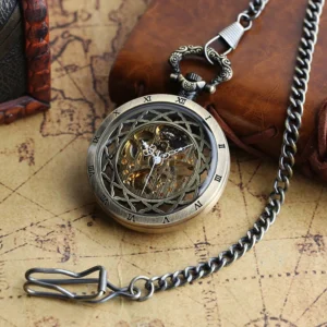 Skeleton steampunk pocket watch with ornate bronze floral frame and exposed mechanical gears, displayed on vintage map with leather notebook and wooden box, three-quarter overhead view showing intricate movement details