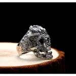 Skull dragon steampunk ring side three-quarter view - gothic silver statement jewelry showing intricate carved details and antique silver tone finish