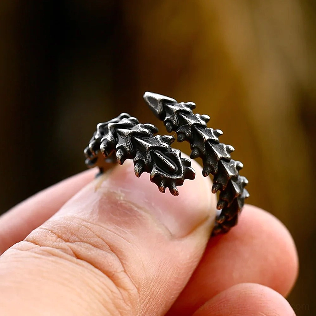 Spinalis steampunk ring close-up side view worn on hand showing vintage black metal with detailed spinal carvings and fit