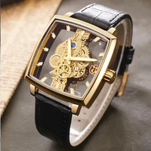 Square mechanical steampunk watch with transparent dial revealing intricate exposed gears, polished gold case and crocodile-pattern leather strap in three-quarter top view