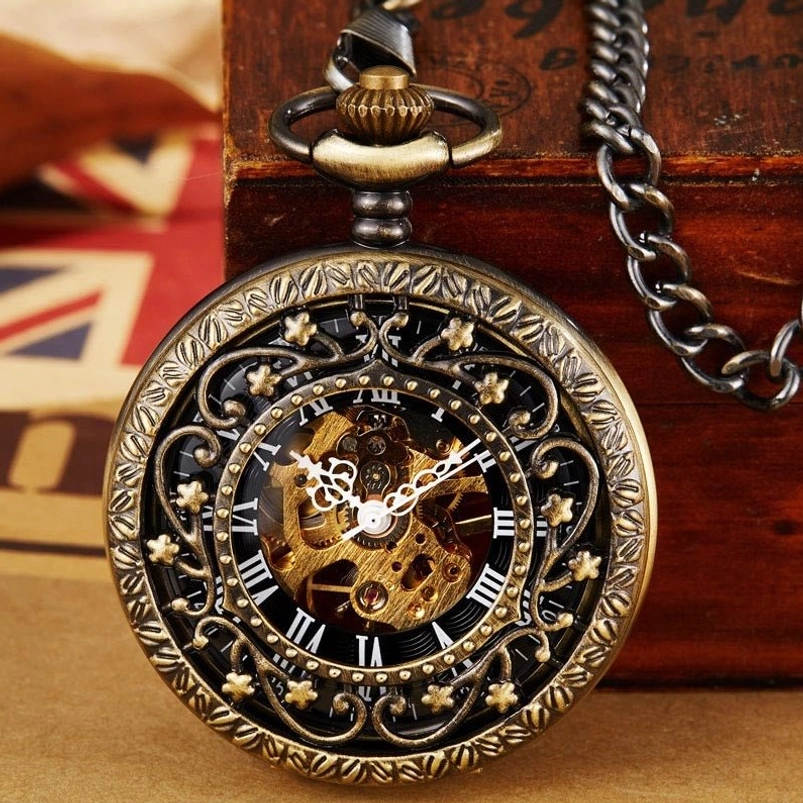 Star steampunk pocket watch with bronze hollow floral case and black dial, showcasing exposed golden mechanical movement in vintage wooden box setting with retro newspaper backdrop