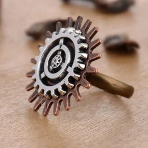 Adjustable steampunk flower ring showcasing intricate gear-shaped floral design in vintage copper and silver tones from overhead perspective