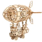 Assembled steampunk airship wooden puzzle - left front three-quarter view showing natural wood finish, prominent R gear emblem, and articulated tail fins