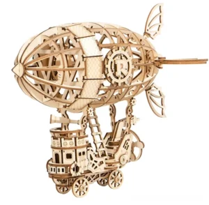 Assembled steampunk airship wooden puzzle - left front three-quarter view showing natural wood finish, prominent R gear emblem, and articulated tail fins