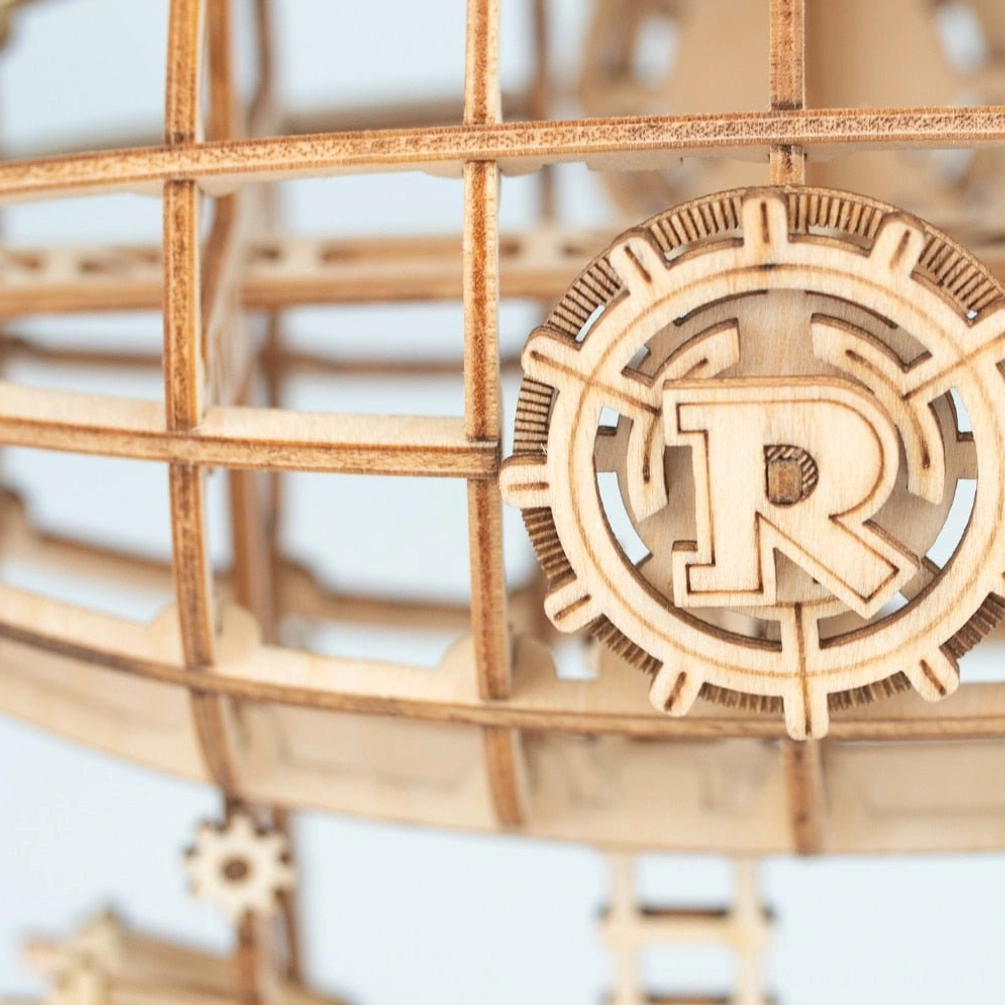 Close-up detail of steampunk airship envelope showing wooden lattice framework and large decorative gear emblem