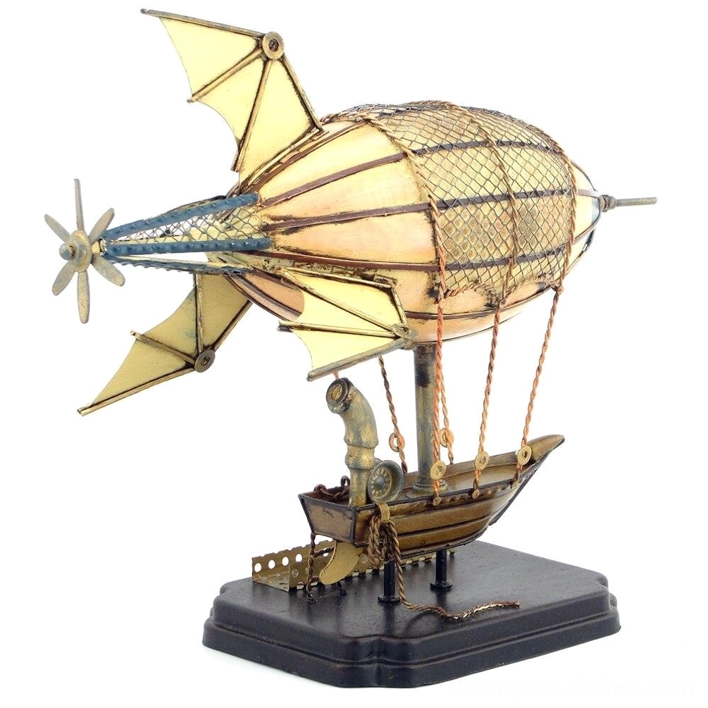 Right side view of handcrafted steampunk airship showing bat-shaped metal wings and functional rear propeller mechanism