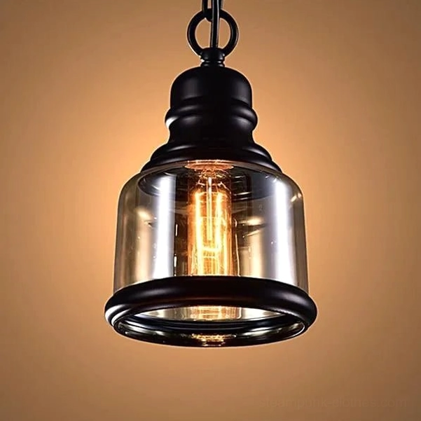 Single amber steampunk pendant light with cylindrical glass shade in studio lighting, showing front-facing industrial design