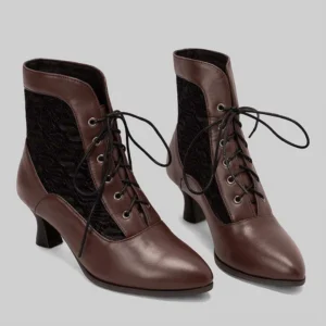 Pair of brown Victorian lace-up steampunk ankle boots with black lace paneling and metal eyelets displayed flat lay studio photography