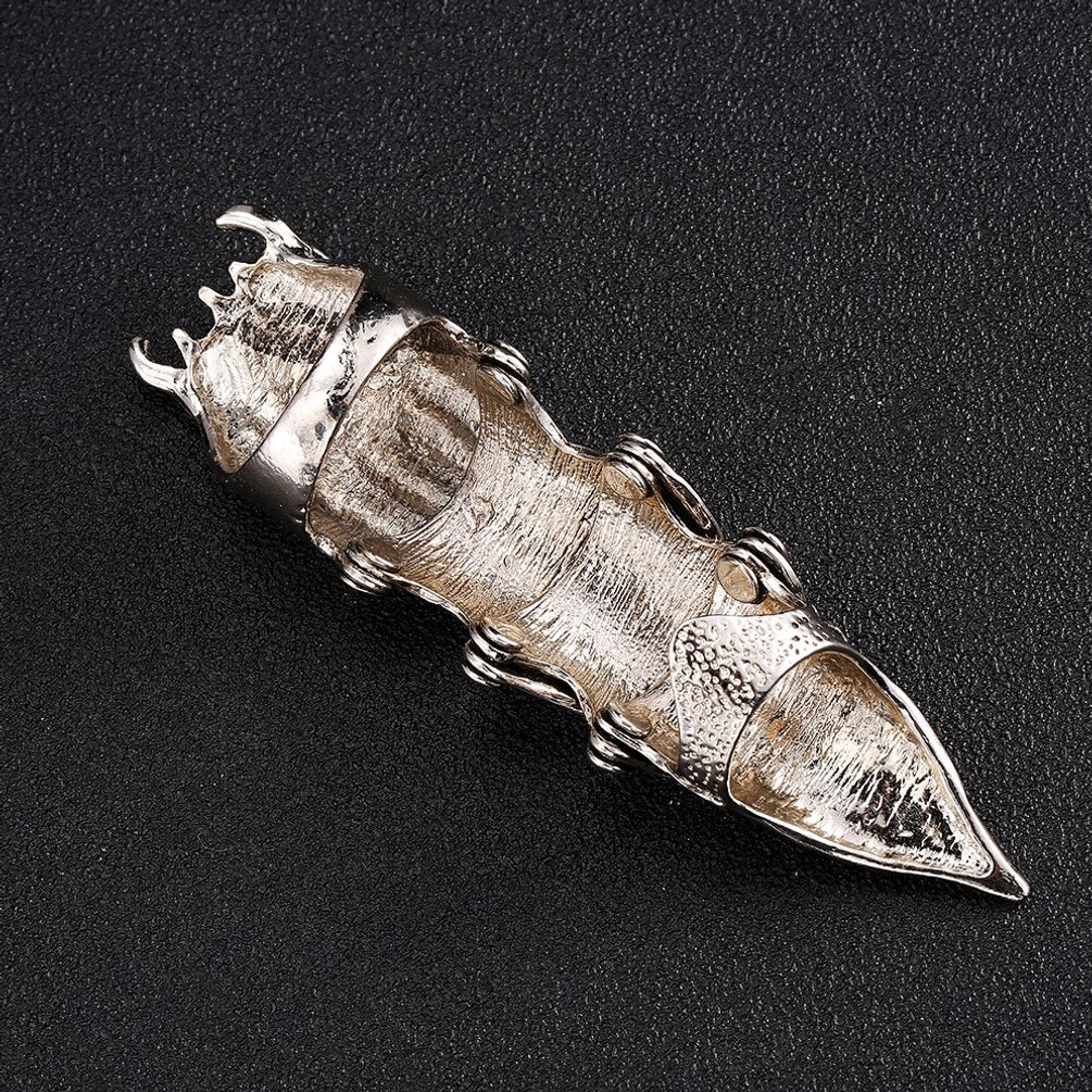 Underside bottom view of articulated steampunk owl finger armor displaying the wearable hollow interior structure, flexible segmented joints, dual-loop base construction, articulation mechanism, and inner wearing surface