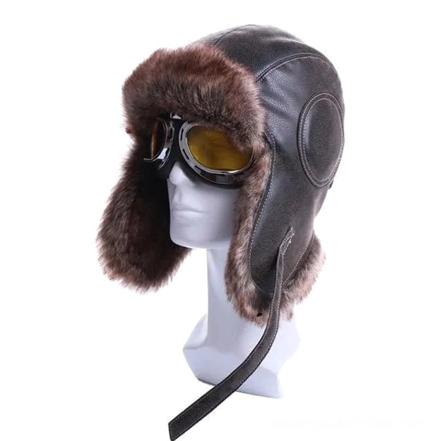 Steampunk aviator chapka hat with dark brown faux leather and yellow tinted flight goggles, left three-quarter view on white mannequin