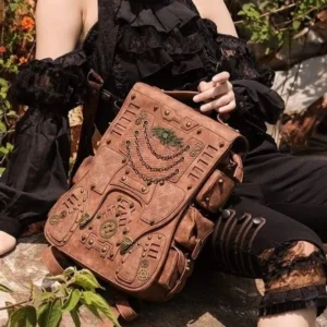 Steampunk leather backpack with mechanical gears and golden chains worn by female model in gothic black lace, outdoor garden setting with distressed brown vintage aesthetic