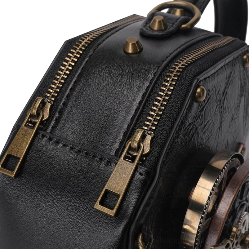 Steampunk octagonal bag side close-up detail showing dual brass zippers, hand-riveted hardware, leather stitching precision, and distressed leather texture