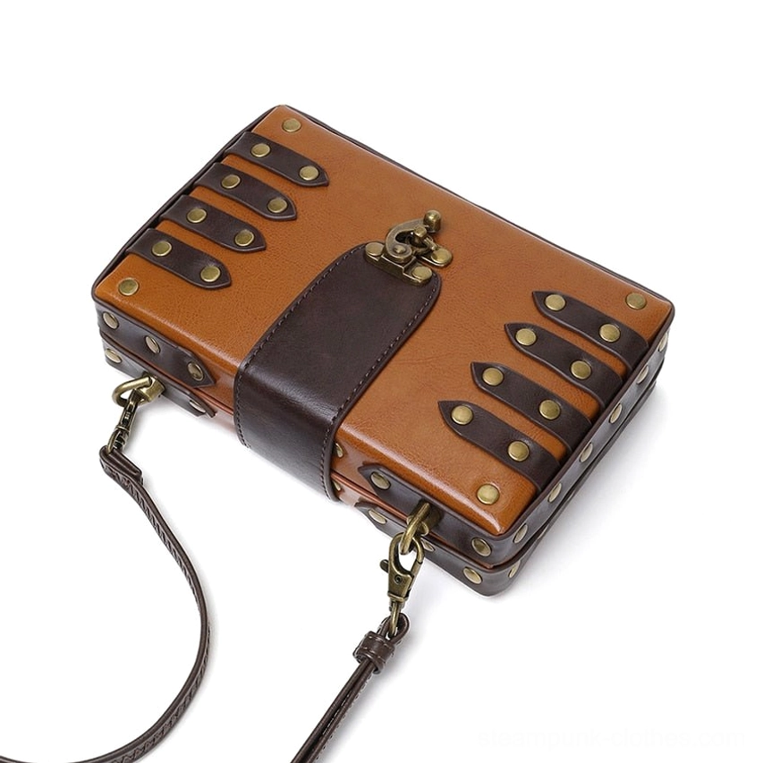 Top angled perspective of steampunk crossbody bag showing detachable adjustable shoulder strap, evenly distributed brass rivets on structured panels, and vintage hardware