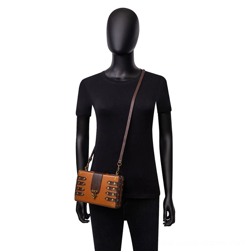Female mannequin wearing steampunk leather crossbody bag in casual crossbody carrying position demonstrating daily wear style and adjustable strap functionality