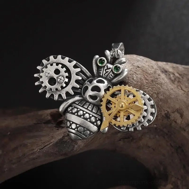 Steampunk bee pendant showcasing intricate dual-tone brass and silver construction with mechanical gear embellishments and luminous green rhinestone eyes - front right angle detail shot