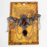 Steampunk beetle necklace packaged in branded retail presentation with silver chain and amber gemstone centerpiece