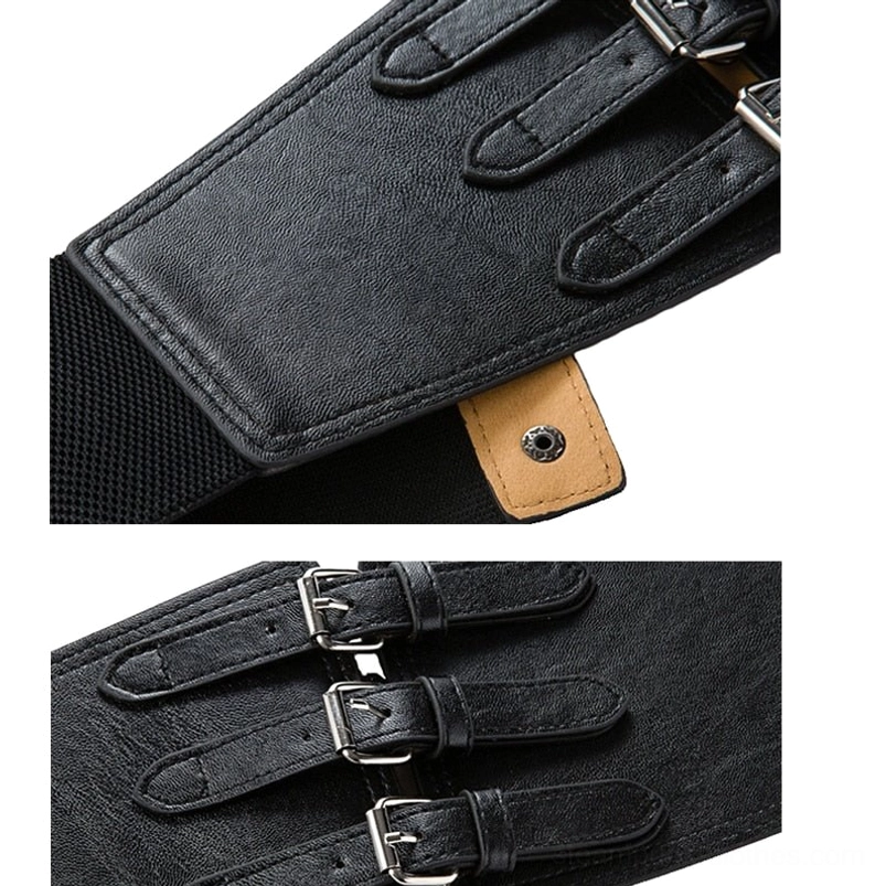 Close-up detail of steampunk belt joint showing black leather, tan snap tab, elastic fabric backing, and fastener construction, macro shot
