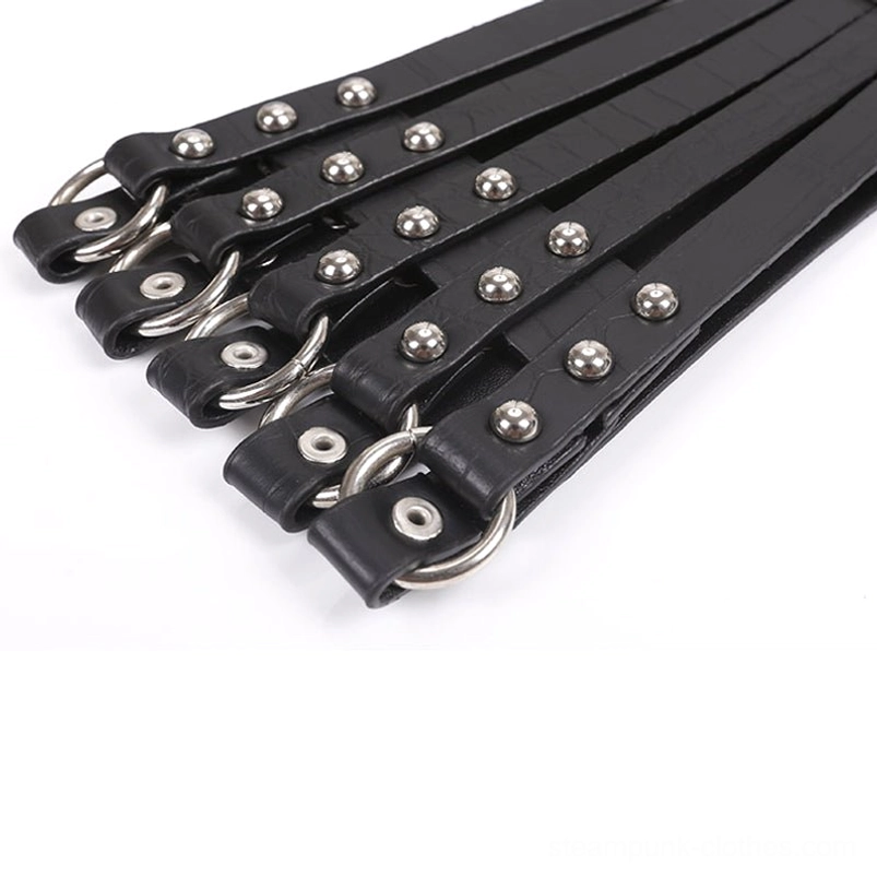 Black faux leather steampunk corset belt fastener end bundled showing D-rings and rivets, demonstrating compact storage configuration and industrial hardware details
